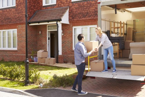 Careful wrapping and boxing of fragile household items during packing