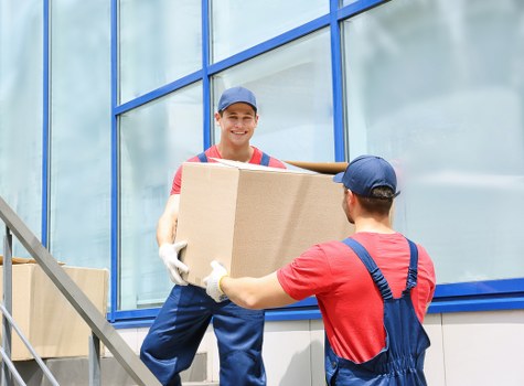 Local removals team handling household items in Barking
