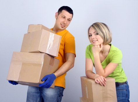 Local van removal team handling boxes and household items