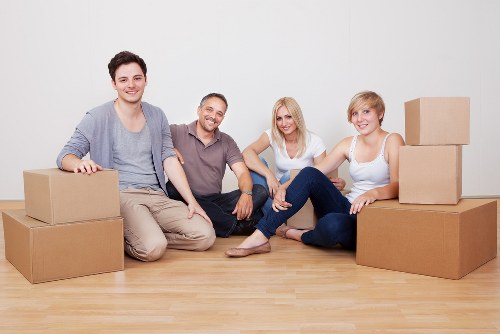 Professional moving crew handling boxes carefully during a Barking relocation