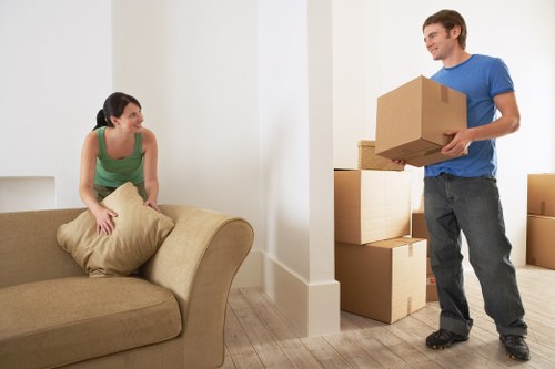 Packed moving boxes and furniture ready for local removals