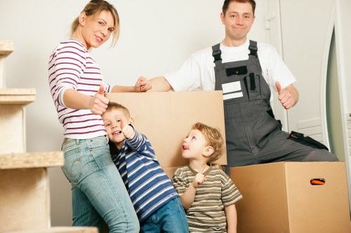 Removal van loading furniture and boxes for a Barking home move